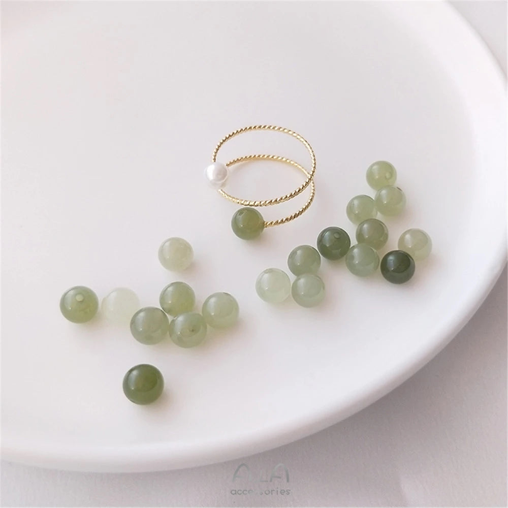 Jade is a gemstone that comes in a variety of green colors, and the term "jade" is often used to describe these shades of green. Jade colors can range from pale green to deep, rich green hues. T