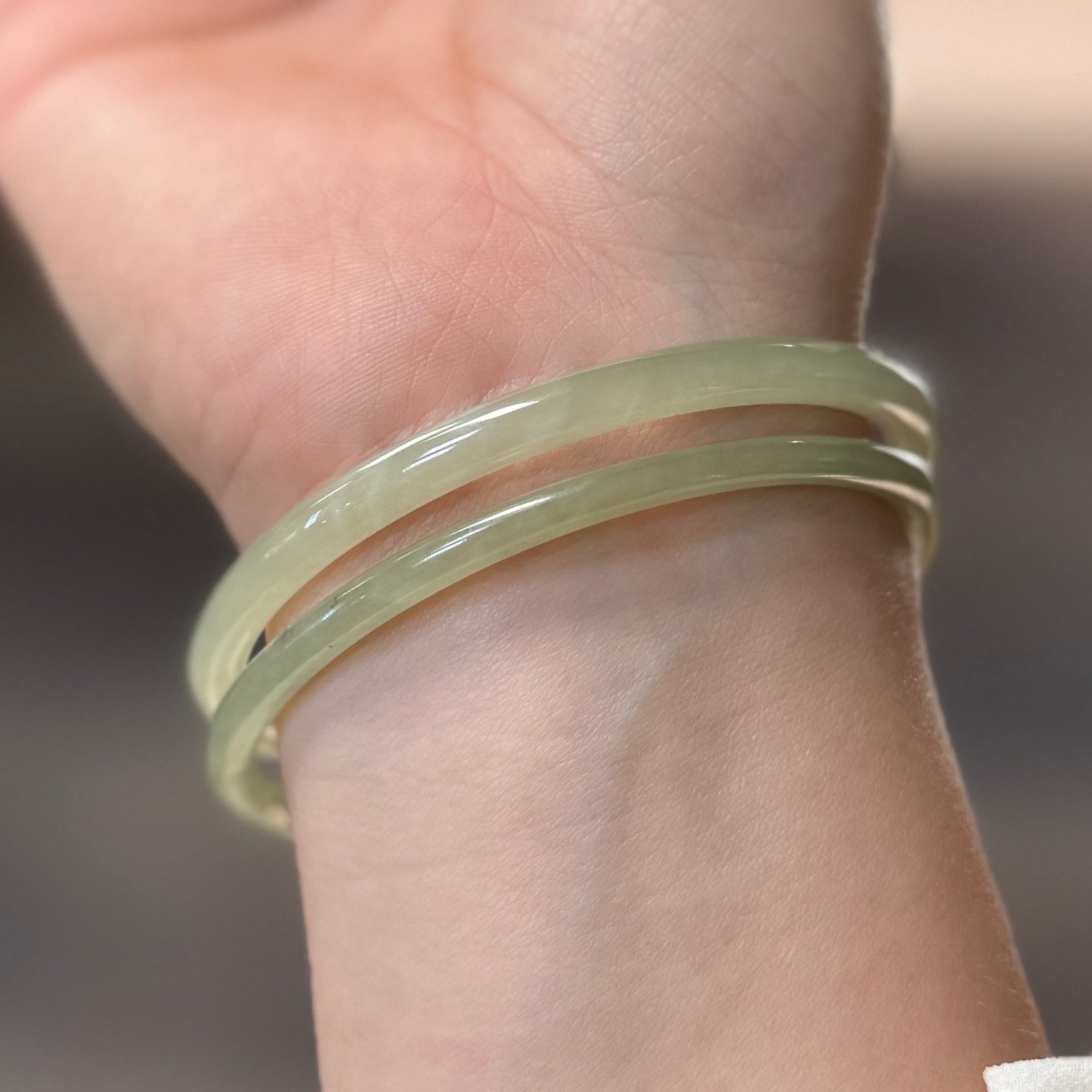 Natural White Jade showcasing unique black inclusions and delicate cotton-like textures—each piece naturally one of a kind.