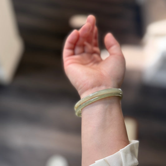 Natural White Jade showcasing unique black inclusions and delicate cotton-like textures—each piece naturally one of a kind.