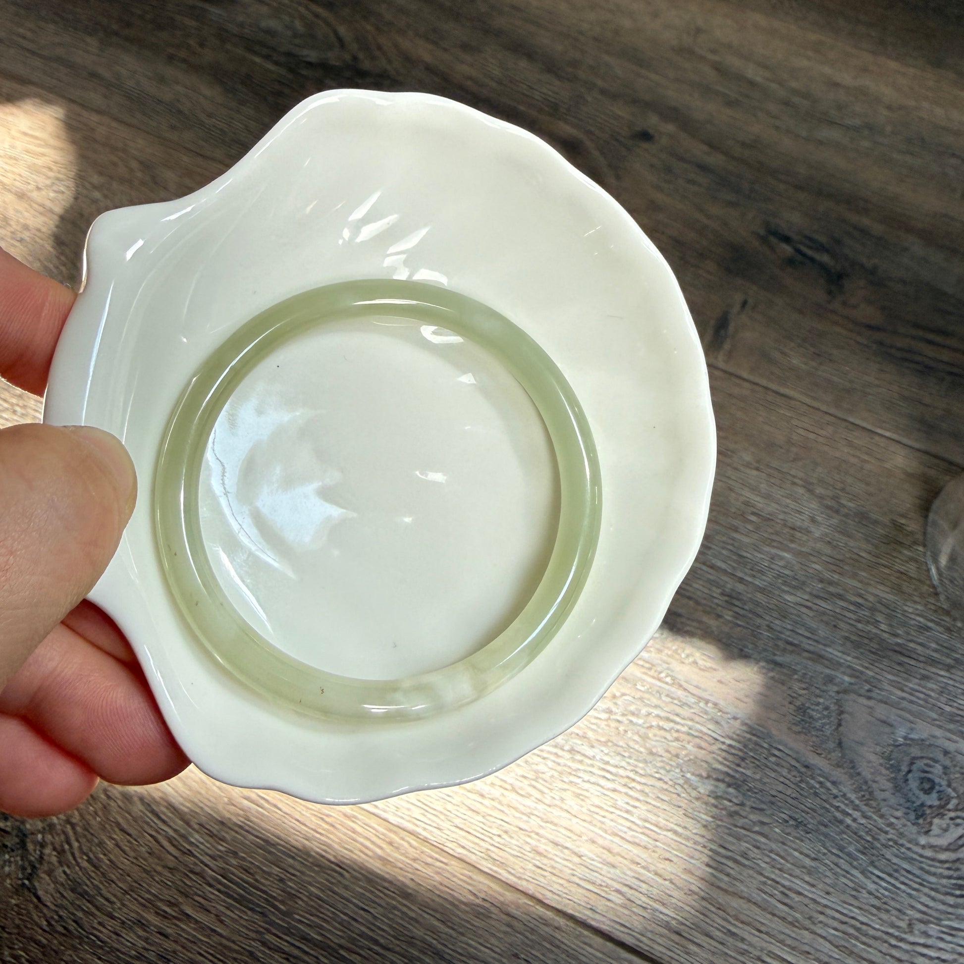 Natural White Jade showcasing unique black inclusions and delicate cotton-like textures—each piece naturally one of a kind.