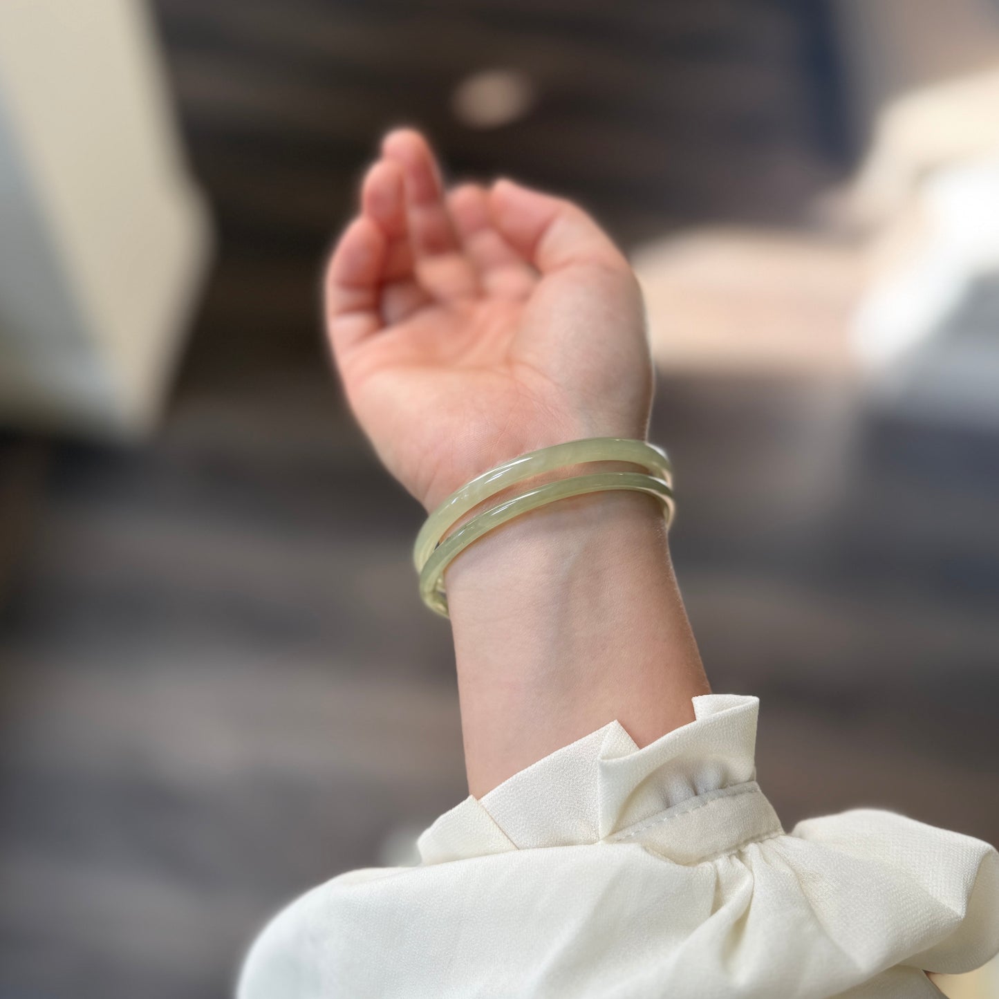 Natural White Jade showcasing unique black inclusions and delicate cotton-like textures—each piece naturally one of a kind.