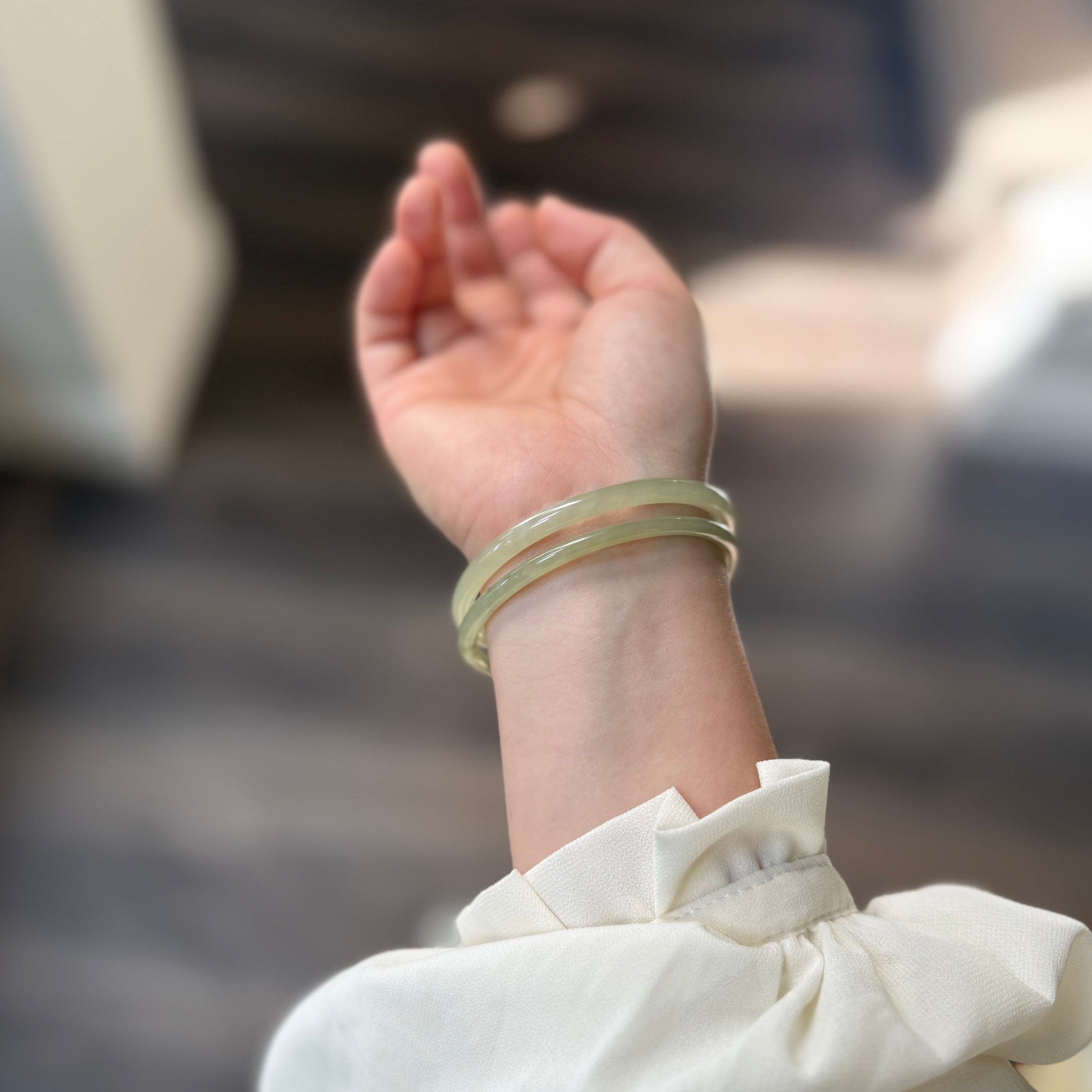 Natural White Jade showcasing unique black inclusions and delicate cotton-like textures—each piece naturally one of a kind.