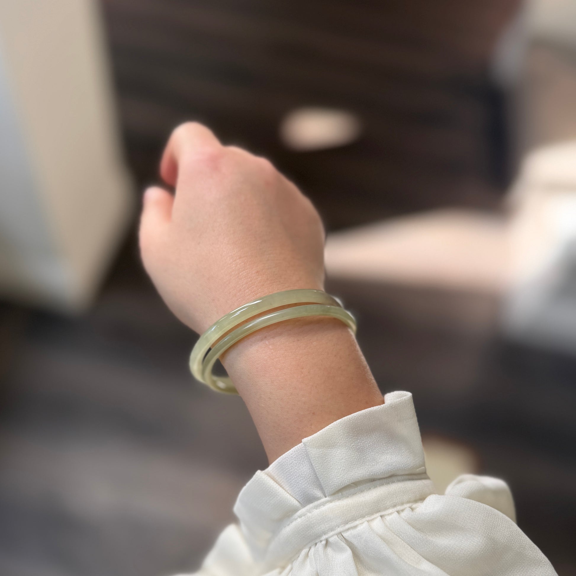 Natural White Jade showcasing unique black inclusions and delicate cotton-like textures—each piece naturally one of a kind.