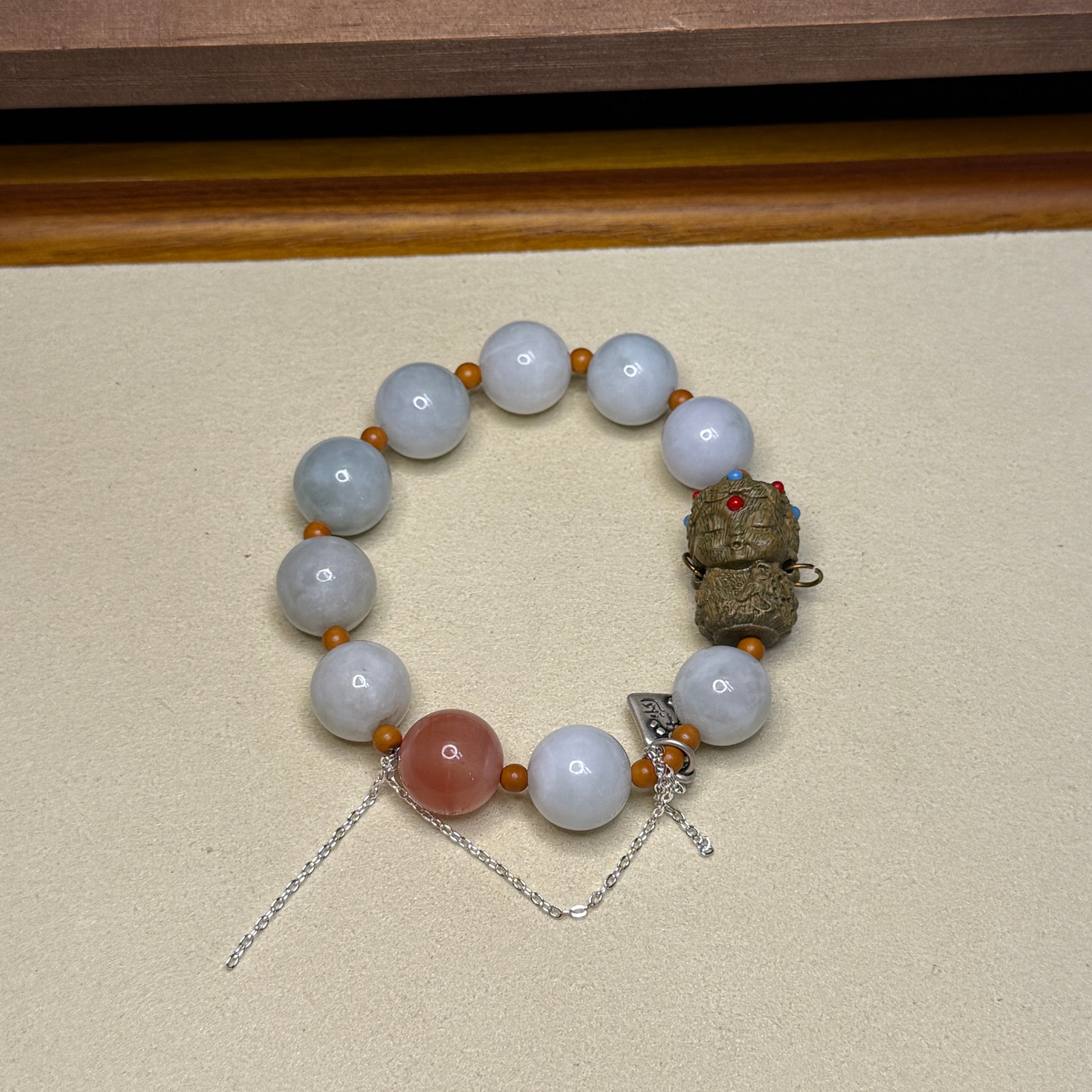white Beaded Jadeite Bracelet with wood baby Buddha